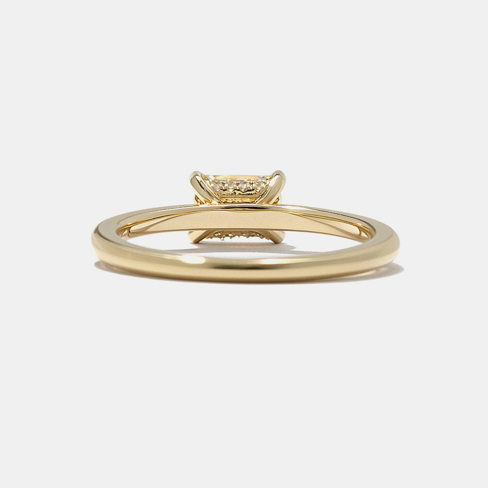0.75 carat east west emerald cut lab grown diamond engagement ring with hidden halo and minimalist solitaire design