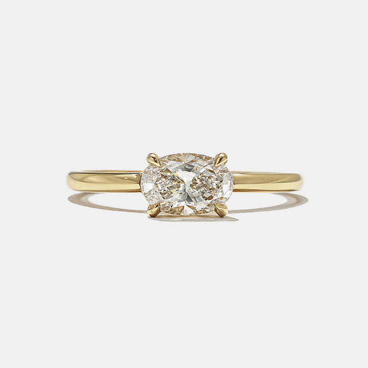 Front view of 0.75 carat east west oval lab grown diamond hidden halo engagement ring with horizontal modern design