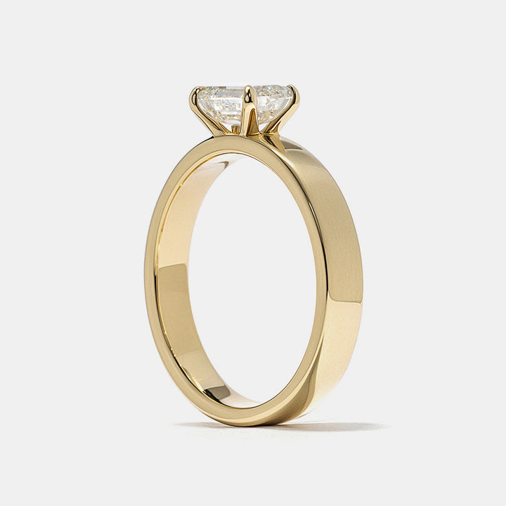 0.75 carat east west emerald E VS1 lab grown diamond cigar band solitaire engagement ring in minimalist wide band structure