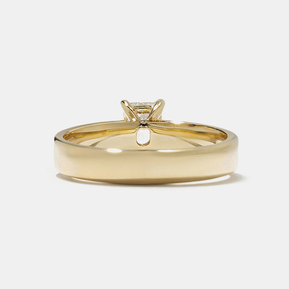 0.75 carat emerald cut E VS1 CVD lab grown diamond solitaire engagement ring set in minimal polished gold band