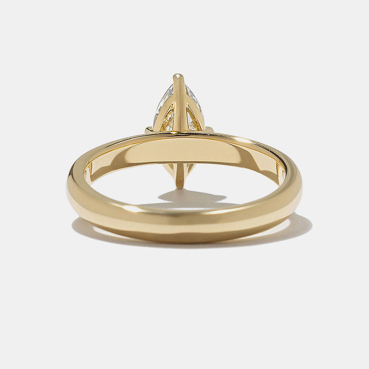 0.75 carat marquise lab grown diamond cigar band solitaire engagement ring set in polished gold minimalist modern design