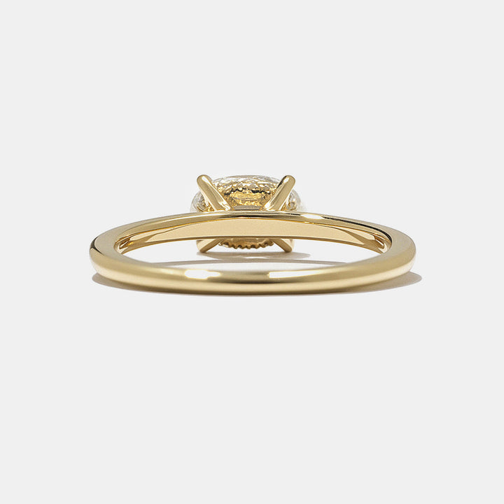 0.75 carat east west oval lab grown diamond engagement ring with hidden halo set in polished gold band