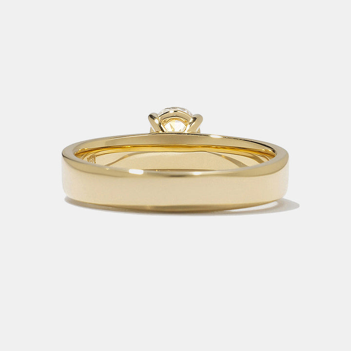 0.75 carat oval E VS lab grown diamond solitaire engagement ring set in polished minimal gold band design