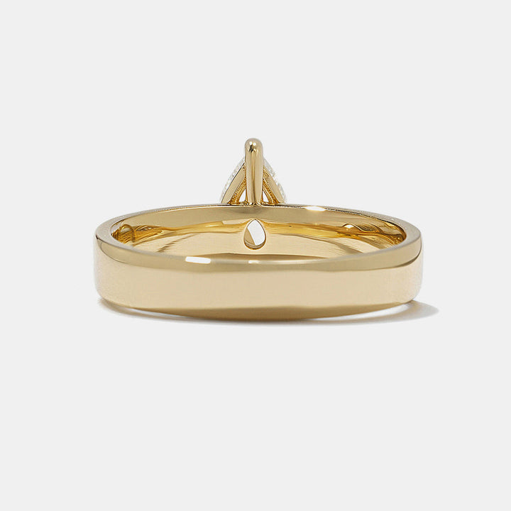 0.75 carat pear E VS1 lab grown diamond cigar band solitaire engagement ring in minimalist wide band structure