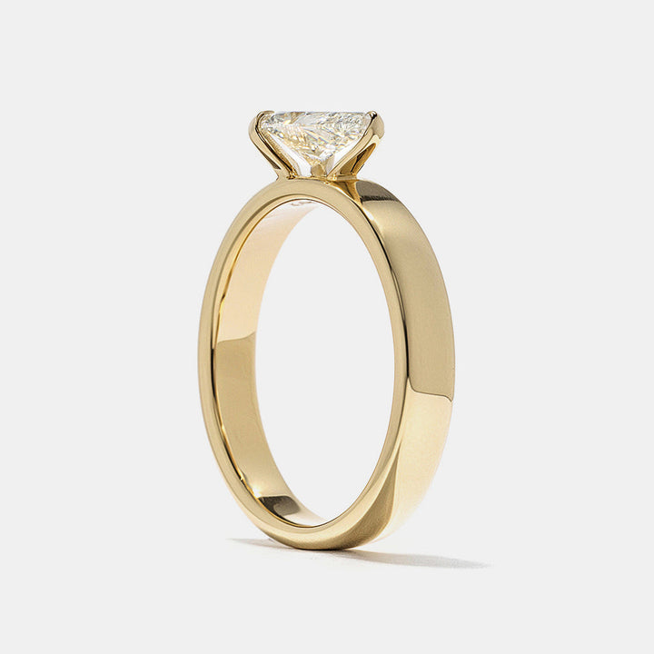0.75 carat east west pear E VS1 lab grown diamond cigar band solitaire engagement ring in minimalist wide band structure