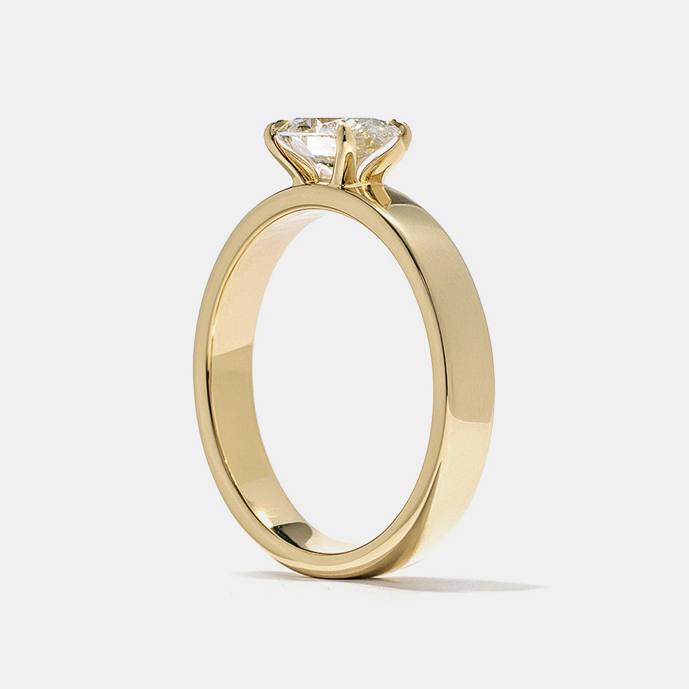 Professional jewelry photography of 0.75 carat east west oval E VS1 lab grown diamond cigar band solitaire engagement ring studio lighting