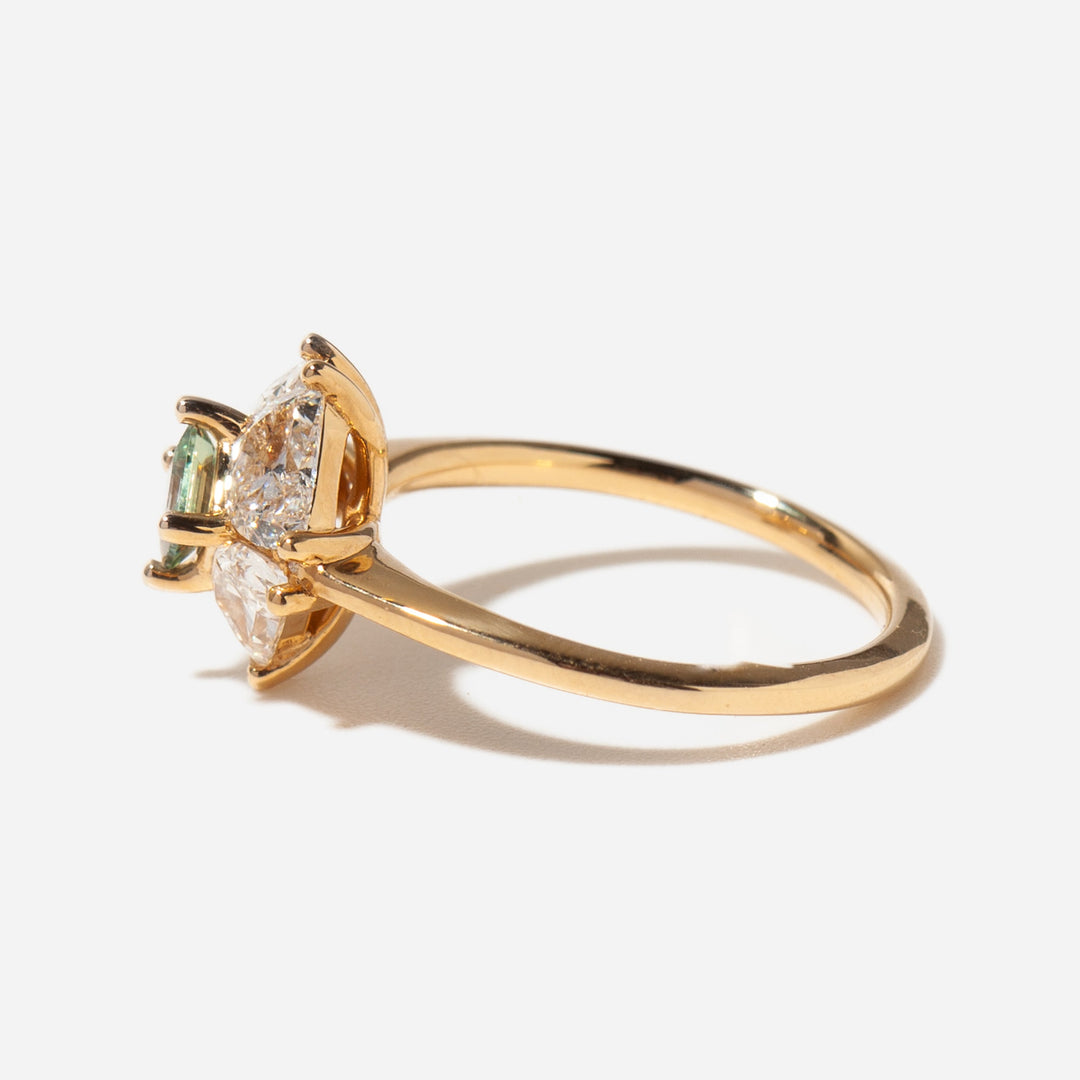 Half moon lab diamond engagement ring with teal sapphire accent set in polished gold modern engagement design