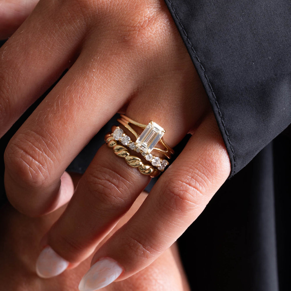 Professional jewelry photography of a 1.5 carat emerald cut lab grown diamond split shank engagement ring