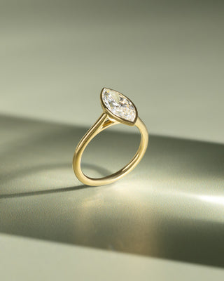 1.50 carat marquise lab grown diamond cathedral engagement ring crafted in polished gold with modern elegance