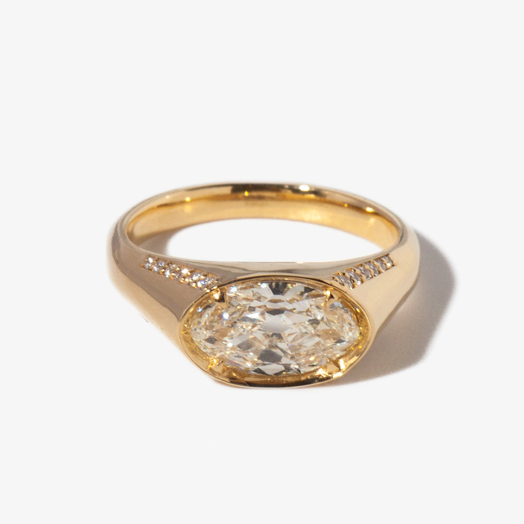 1.5 carat moval cut lab diamond signet engagement ring set in polished gold minimalist modern design