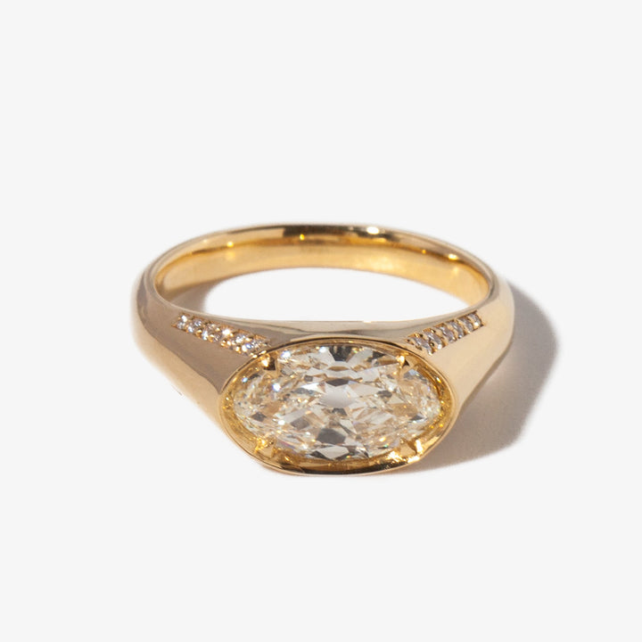 1.5 carat moval cut lab diamond signet engagement ring set in polished gold minimalist modern design