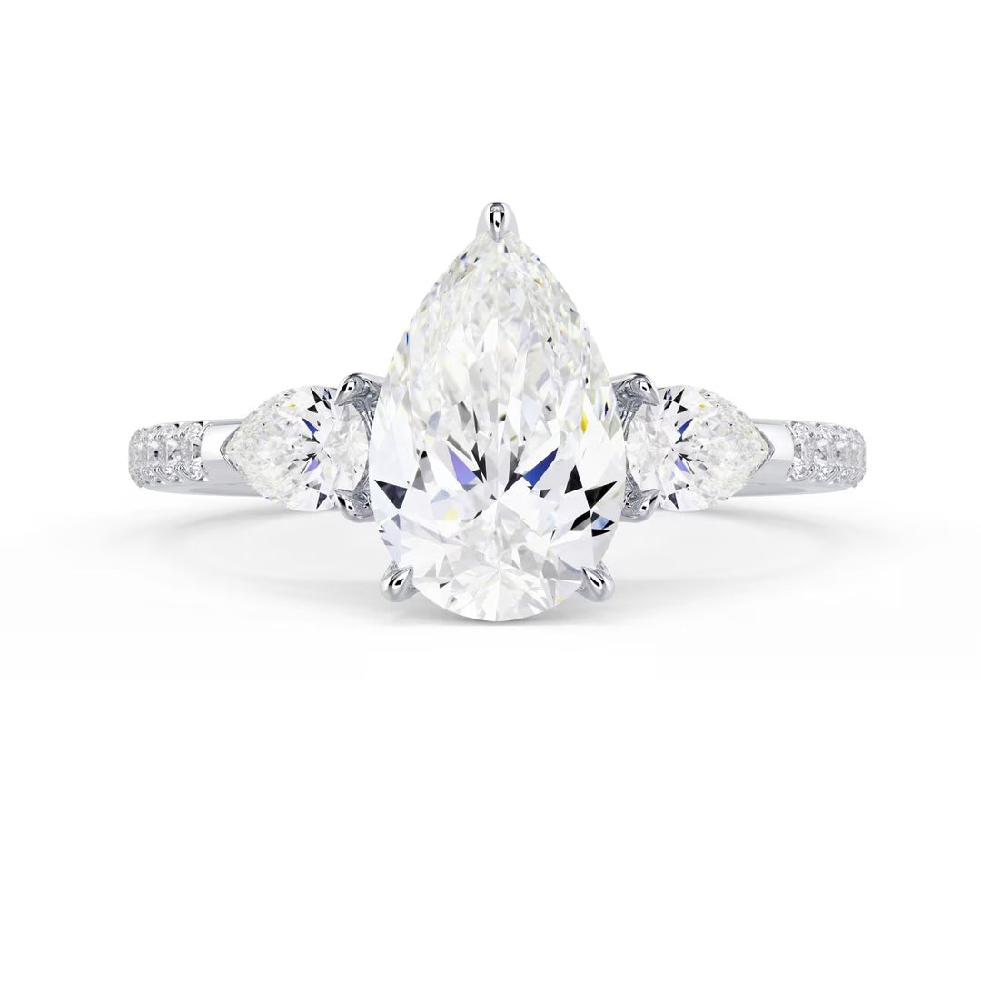 Front view of a 1.50CT pear cut lab grown diamond three stone pave engagement ring with E VS1 quality diamonds