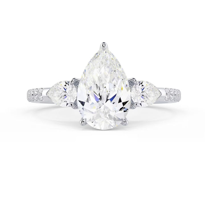 Front view of a 1.50CT pear cut lab grown diamond three stone pave engagement ring with E VS1 quality diamonds