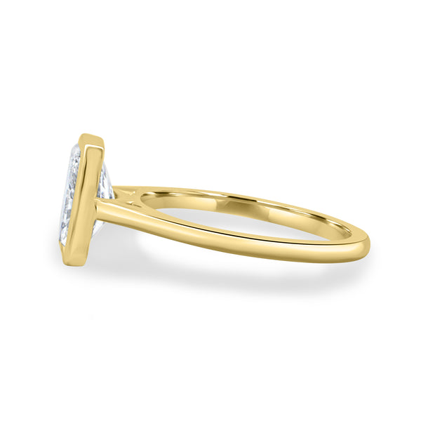 1.50 carat radiant lab grown diamond cathedral engagement ring crafted in polished gold with contemporary elegance
