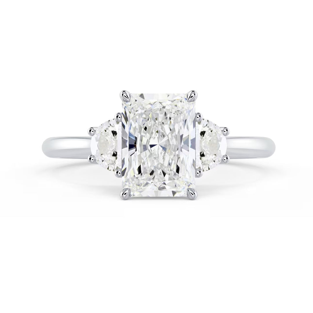 radiant cut three stone engagement ring with side stones E VS2