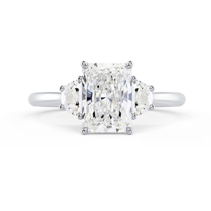 radiant cut three stone engagement ring with side stones E VS2