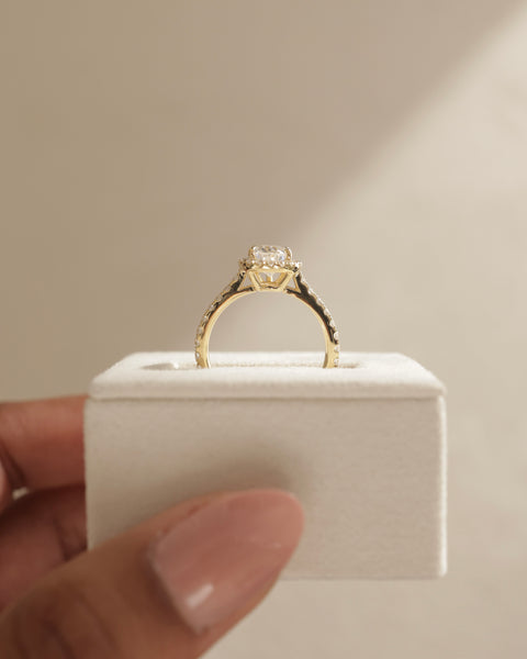 Professional jewelry photography of a 1.50 carat pear lab diamond halo cathedral pavé engagement ring in studio lighting