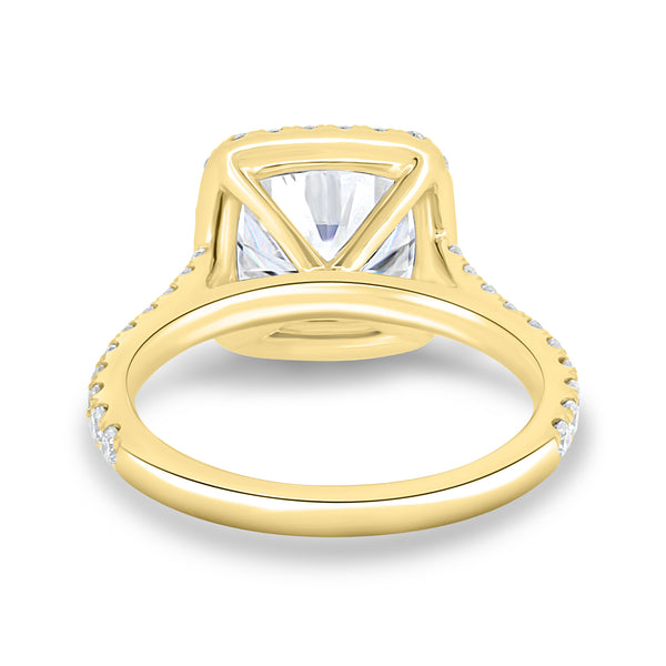 1.5 carat cushion lab grown diamond halo cathedral pavé engagement ring set in polished gold modern bridal style