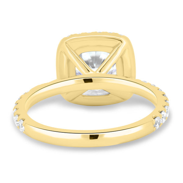 1.5 carat cushion lab grown diamond halo pavé engagement ring set in polished gold modern bridal design