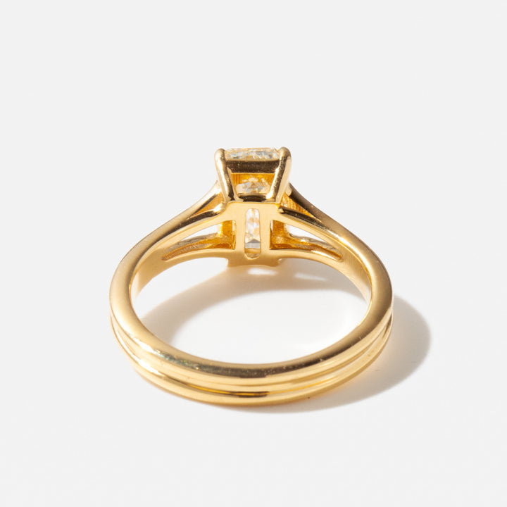 Detailed view of a 1.5 carat emerald cut lab grown diamond engagement ring with a refined split shank design