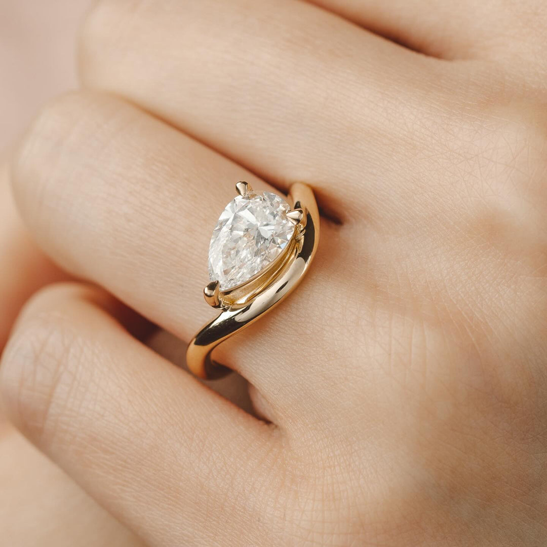 Pear Cut Curved Engagement Ring