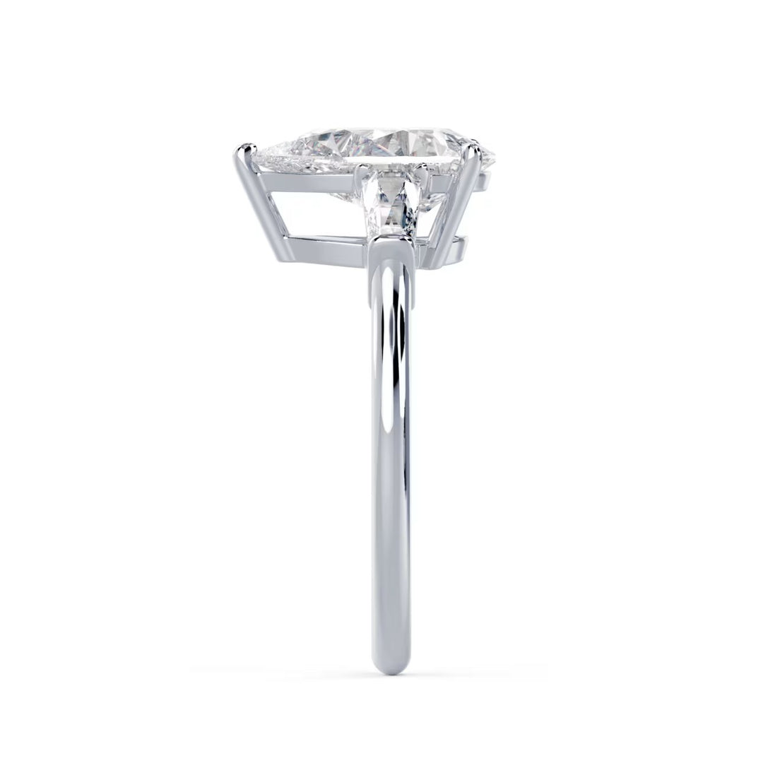 Side profile of a 1.5 carat pear lab grown diamond three stone solitaire engagement ring with a refined setting