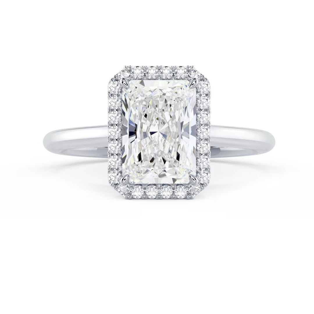 1.5 carat radiant cut lab grown diamond halo solitaire engagement ring set in white gold with strong geometric sparkle