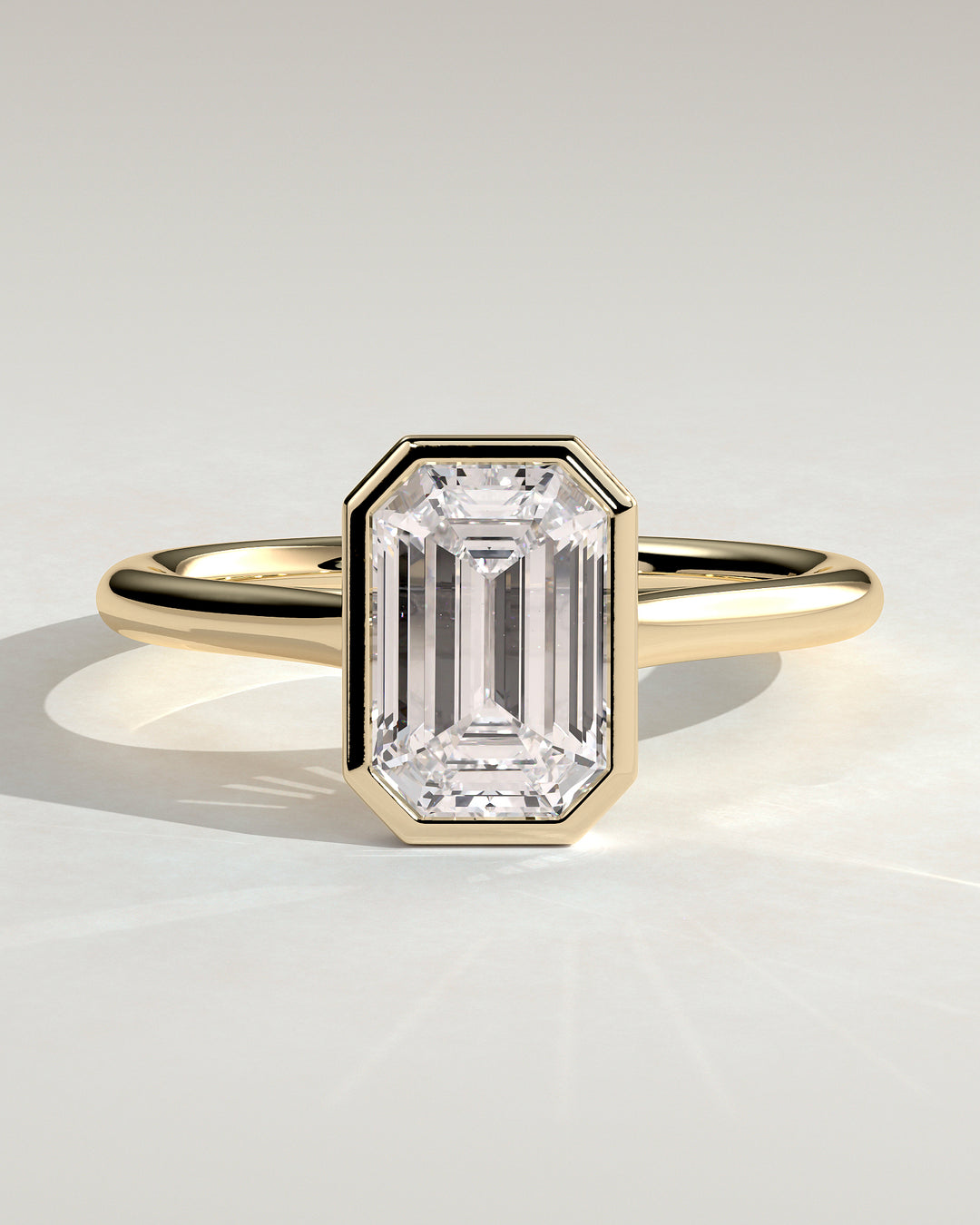1.5ct Emerald Cut Bezel Cathedral High Setting Engagement Ring