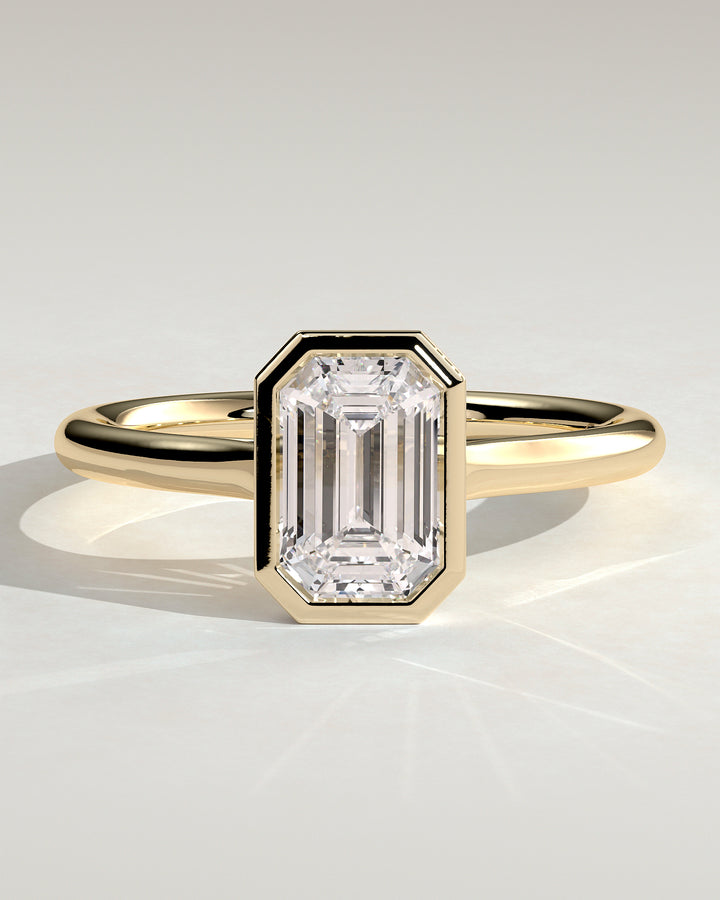 1.5ct Emerald Cut Lab Grown Diamond Bezel Setting Engagement Ring