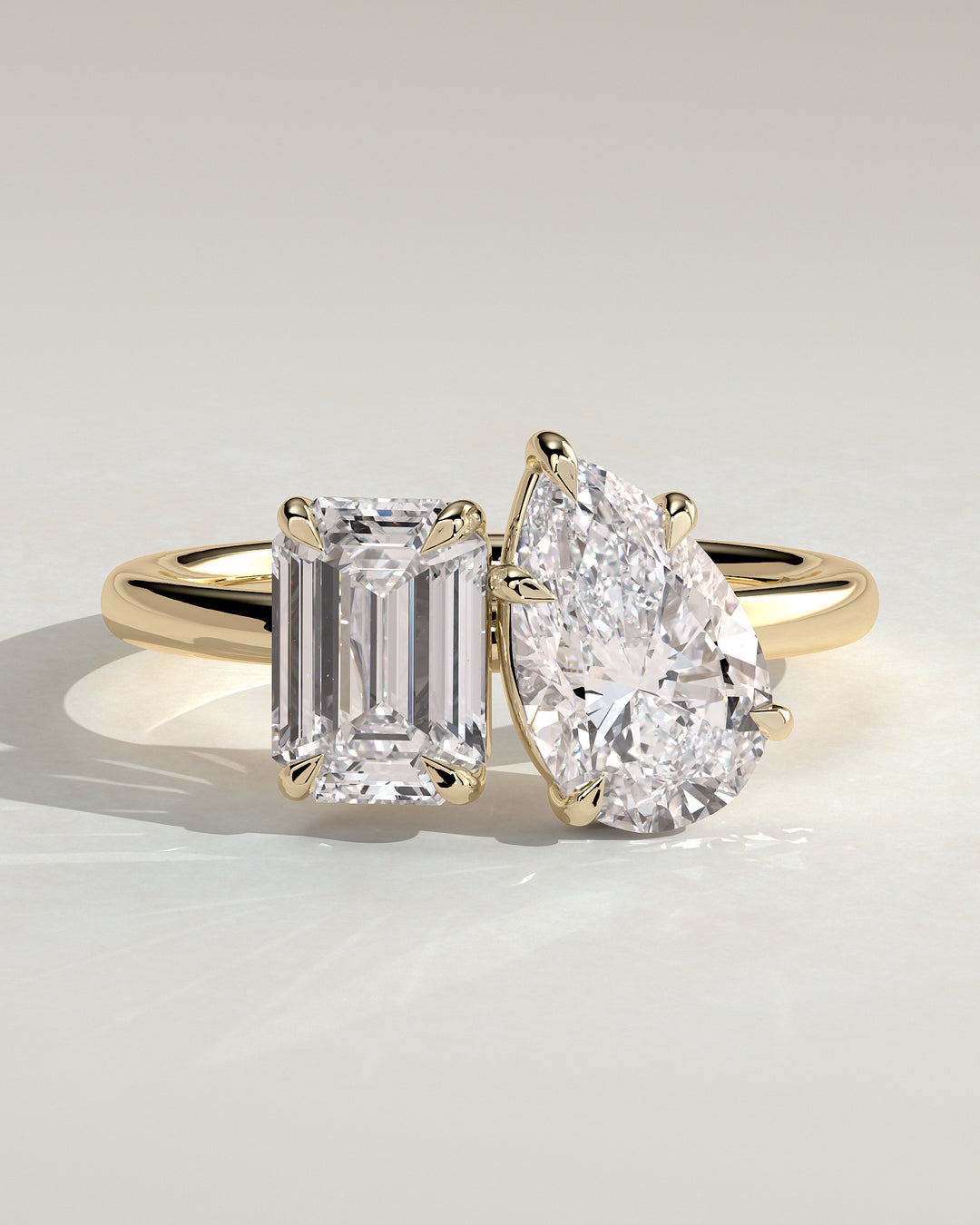 1.5ct Emerald and Pear Toi et Moi Hidden Halo Engagement Ring