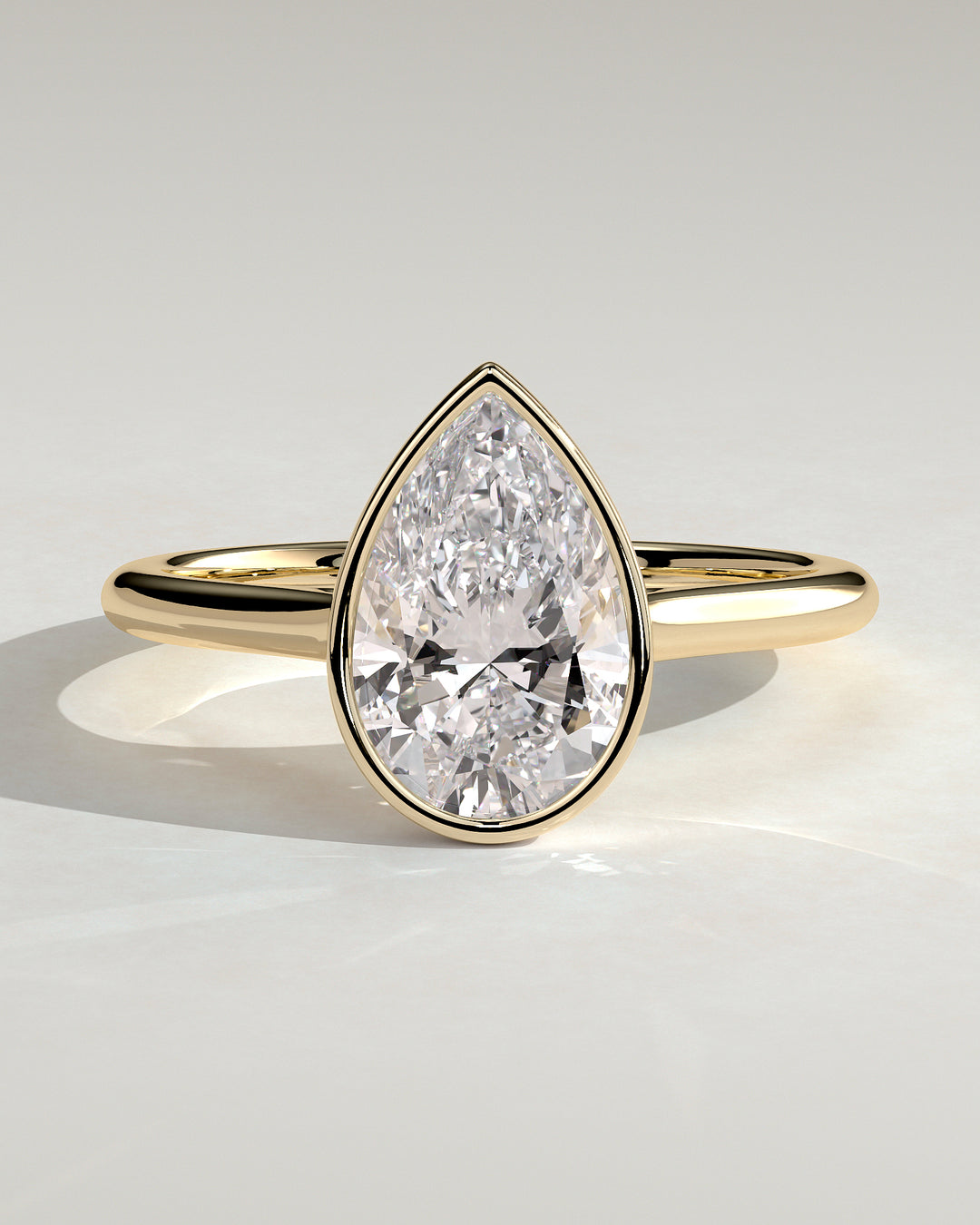 1.5ct Pear Bezel Set Cathedral High Setting Engagement Ring