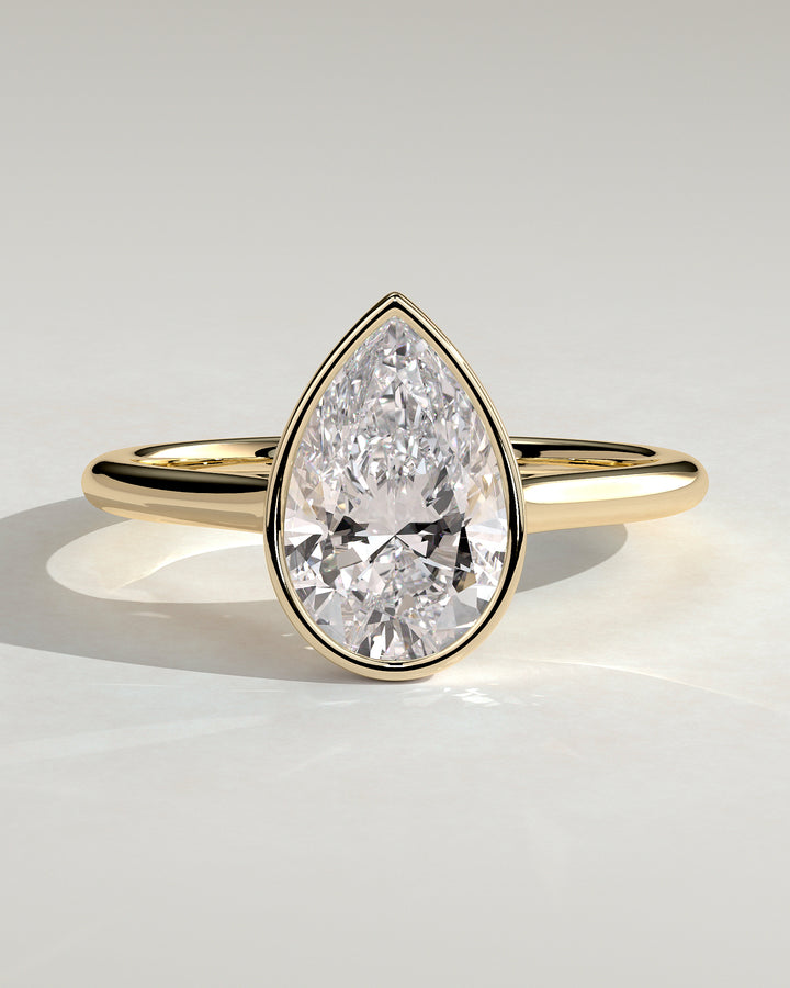 1.5ct Pear Bezel Set Cathedral High Setting Engagement Ring