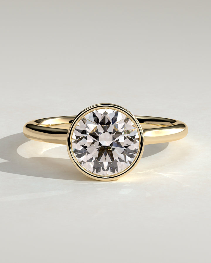 1.5ct Round Bezel Solitaire Twisted Gallery Engagement Ring