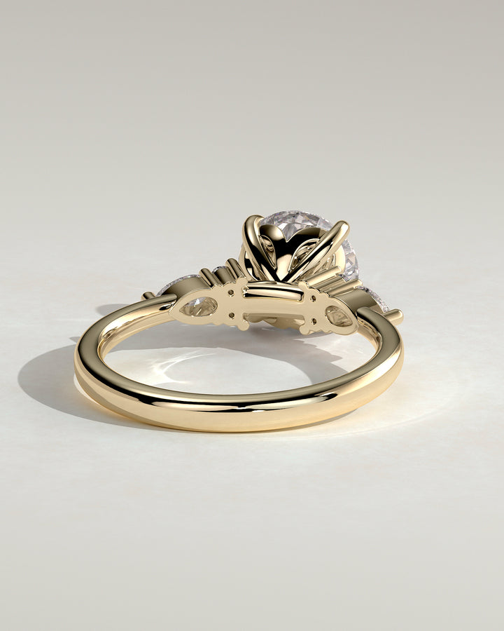 14k solid gold round and pear accent ring