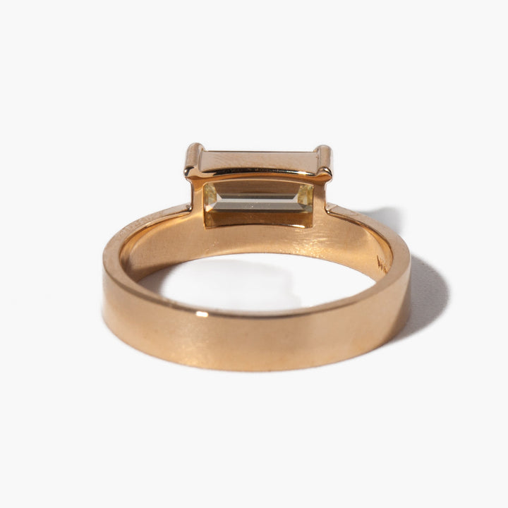 1 carat east west emerald lab diamond monolith engagement ring set in polished gold minimalist modern style