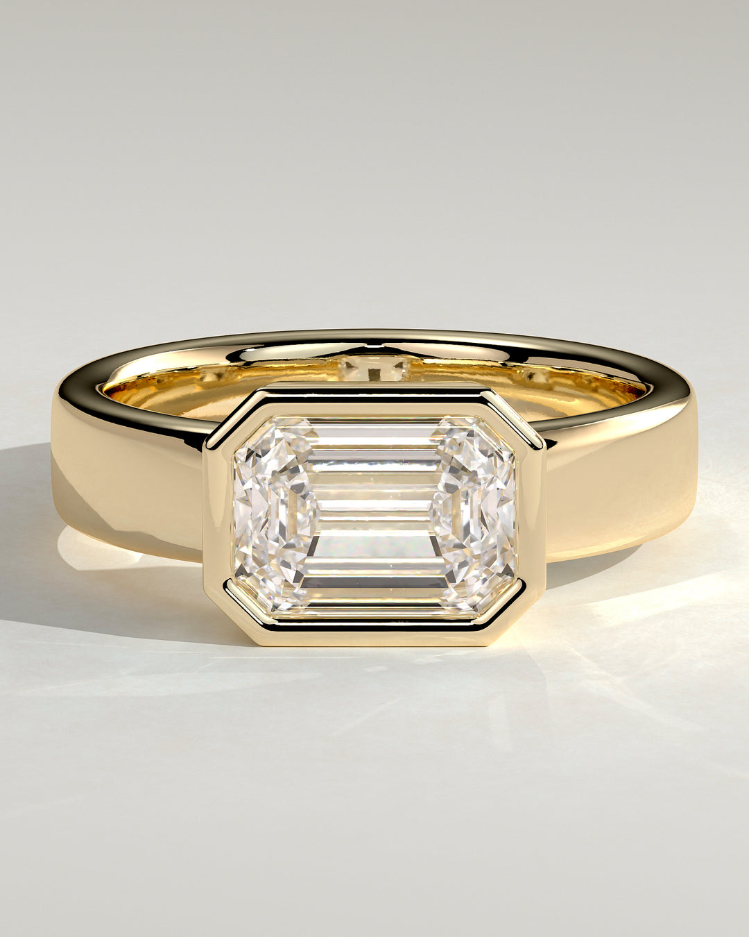 2.0ct East West Emerald Cut Bezel Set Flat Cigar Band Engagement Ring