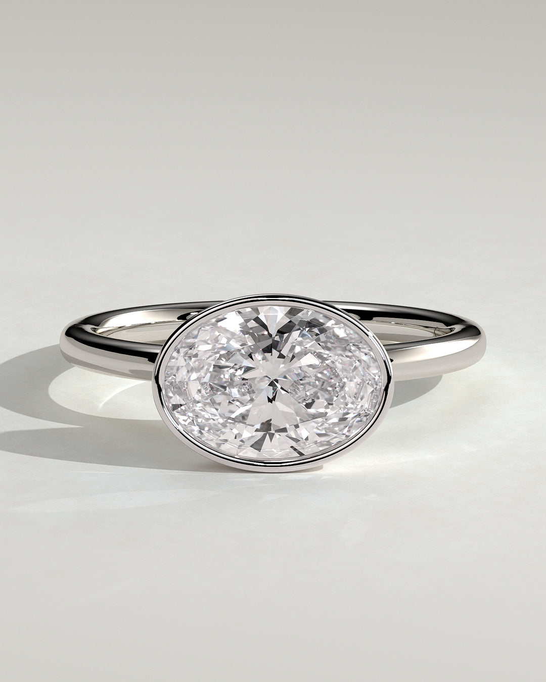 2.0ct East West Oval Bezel Set E/VS1 Solitaire Engagement Ring