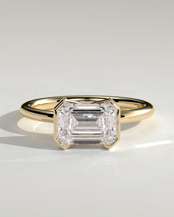 2.0ct Emerald Cut East West Half Bezel Solitaire Engagement Ring