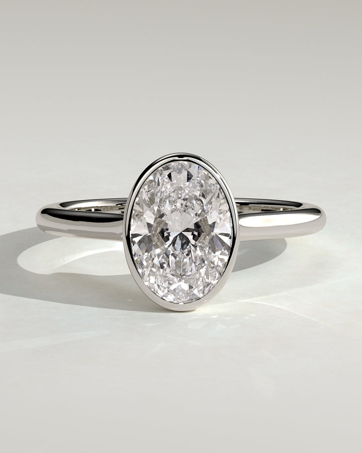 2.0ct Oval Bezel Solitaire F/VS2 Twisted Gallery Engagement Ring