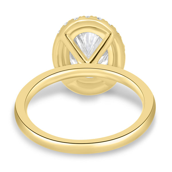 2 carat oval lab grown diamond halo solitaire engagement ring crafted in polished gold with modern bridal appeal
