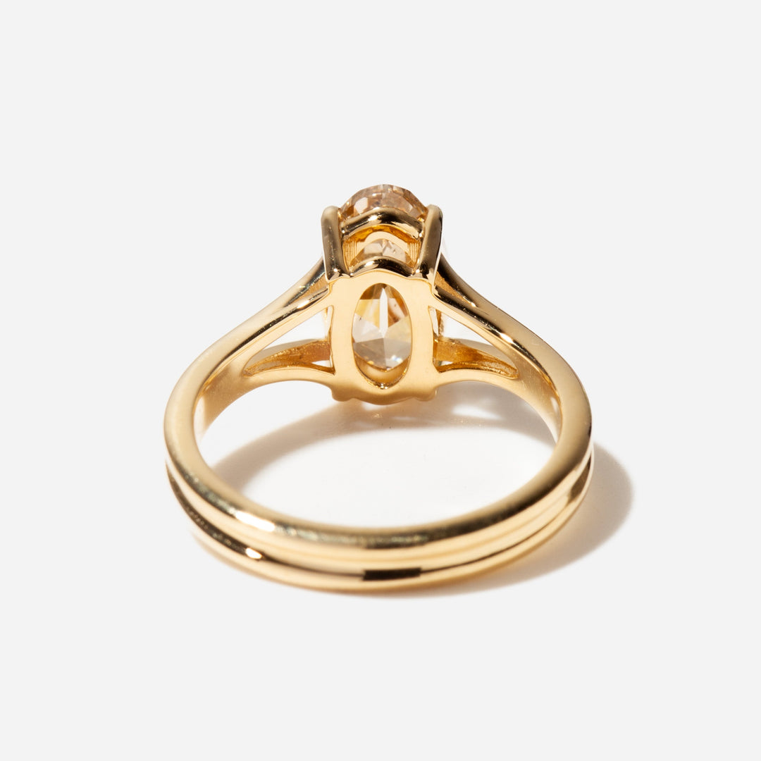 2 carat oval lab diamond engagement ring featuring vintage-inspired styling and a distinctive split shank band