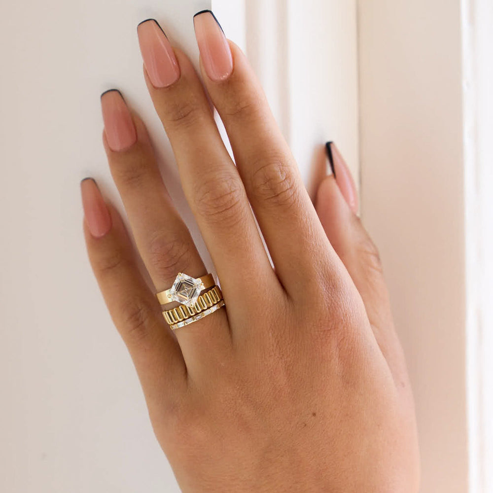Professional jewelry photography of 3.5 carat asscher cut lab grown diamond cigar band solitaire engagement ring studio lighting