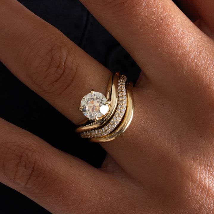 Lifestyle image of a 1.5 carat old European cut lab diamond engagement ring with antique curved design