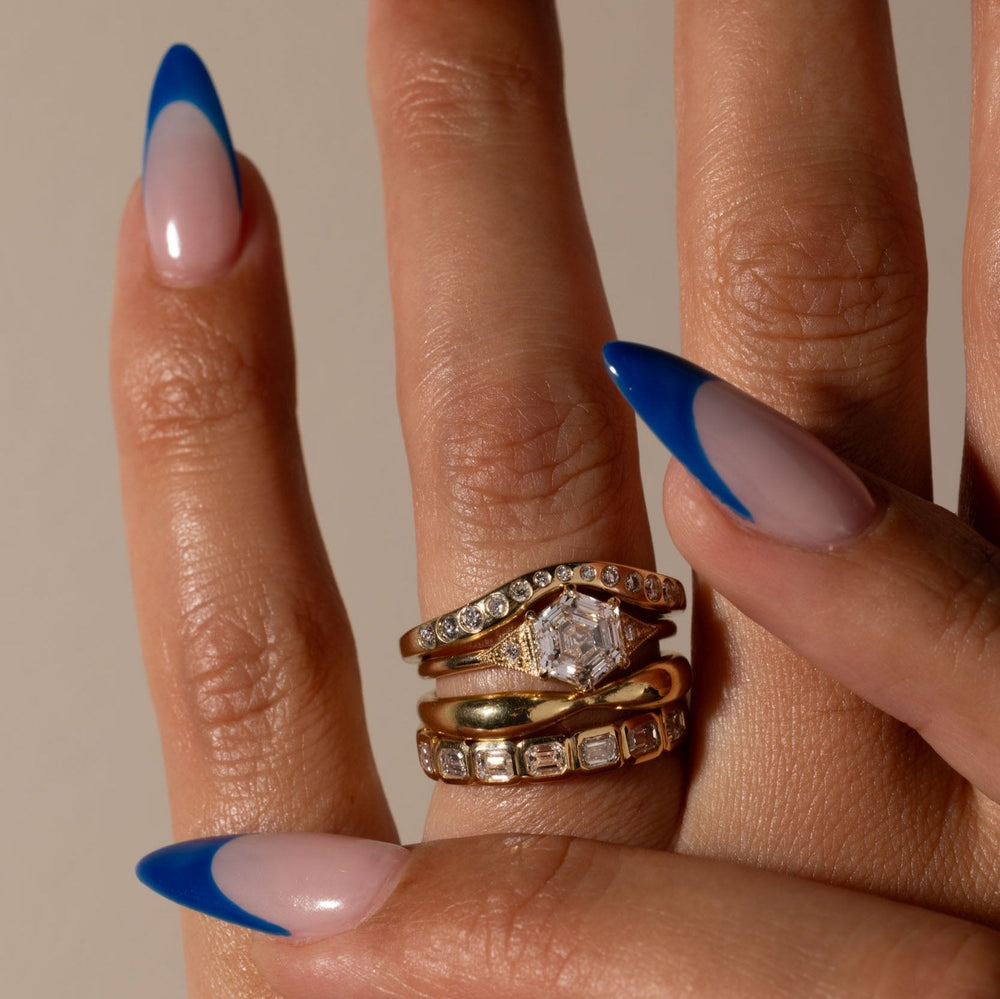 Side profile of hexagon cut lab grown diamond art deco engagement ring highlighting structured modern architectural setting