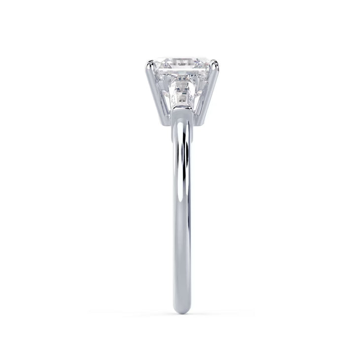 Side profile of an Asscher cut lab grown diamond three stone engagement ring highlighting elegant craftsmanship