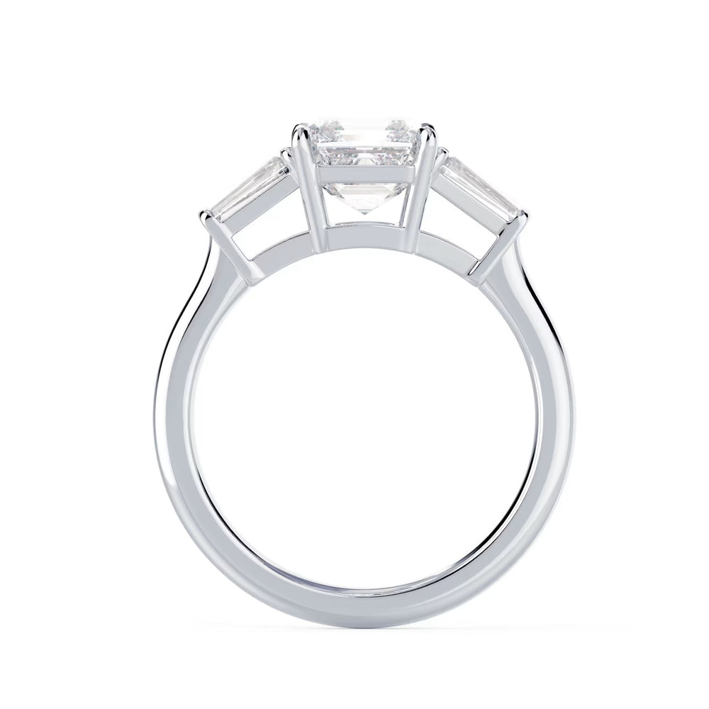 Close-up of an Asscher cut lab grown diamond three stone engagement ring showcasing step-cut brilliance and E VS2 clarity