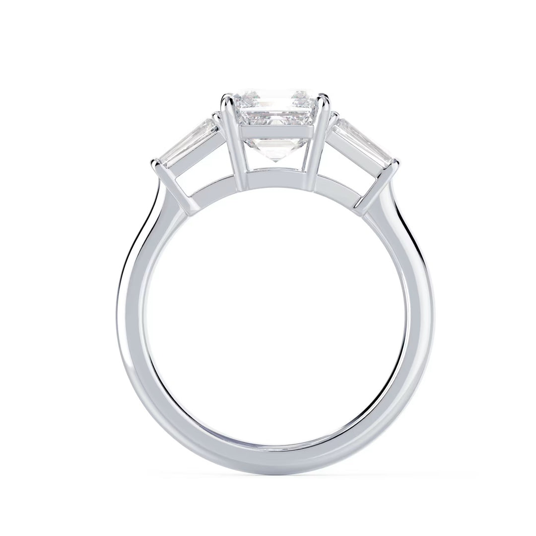 Close-up of an Asscher cut lab grown diamond three stone engagement ring showcasing step-cut brilliance and E VS2 clarity
