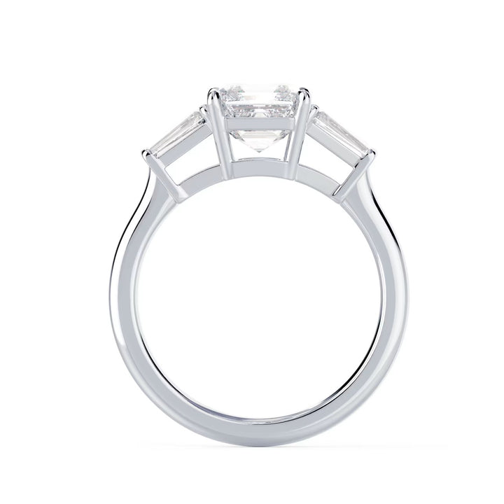 Close-up of an Asscher cut lab grown diamond three stone engagement ring showcasing step-cut brilliance and E VS2 clarity