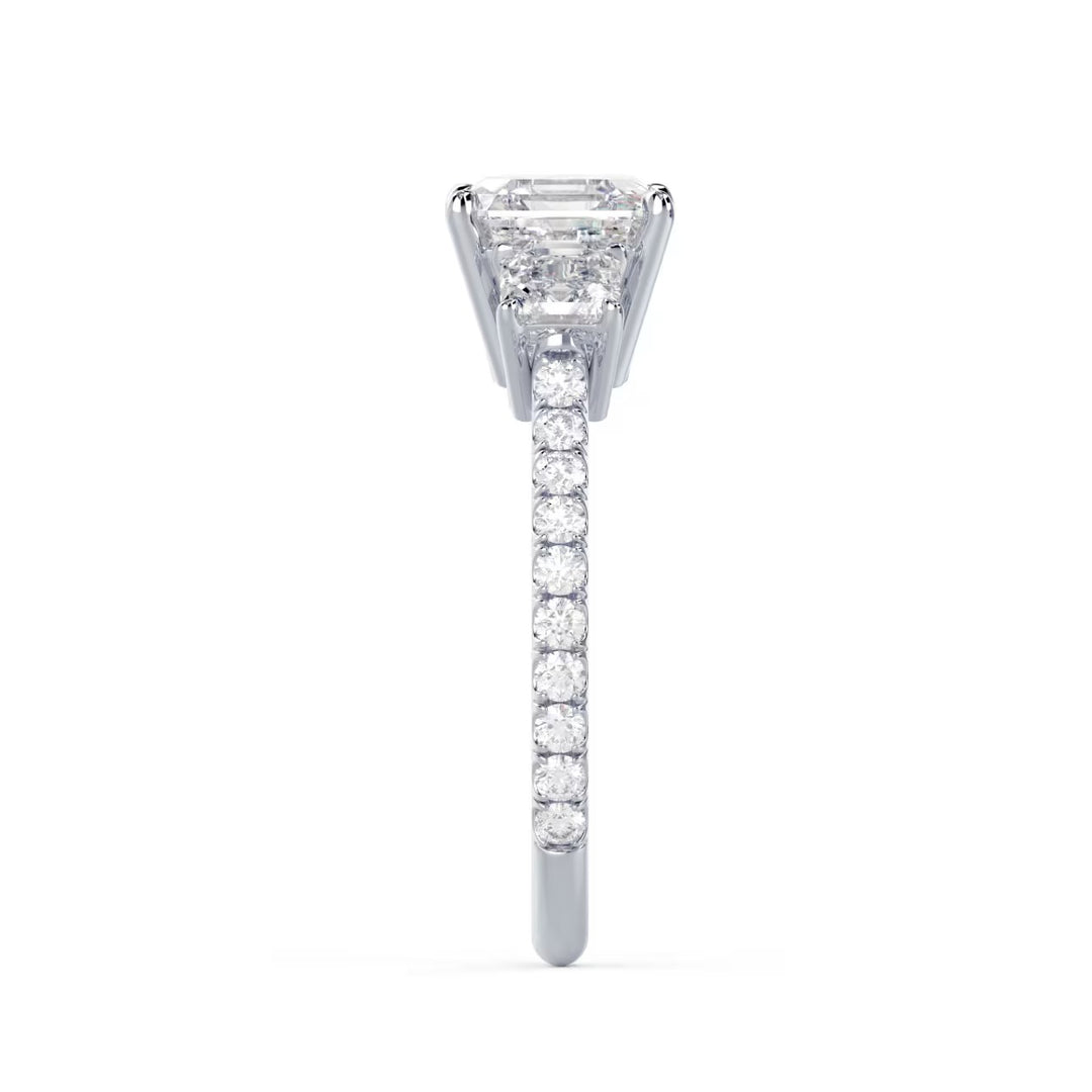Side profile of Asscher cut lab grown diamond three stone pave engagement ring highlighting elegant pavé band detailing