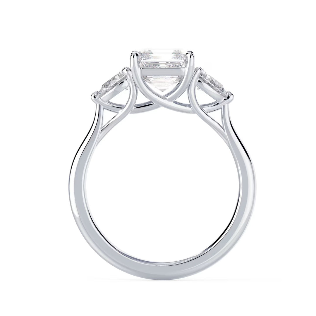 Close-up of Asscher cut lab grown diamond three stone engagement ring with E VS2 clarity and geometric step-cut sparkle